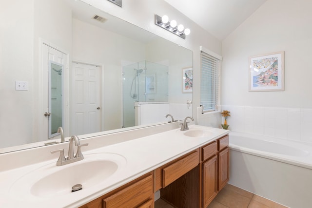 4613 Meridian Park Dr, Pearland, TX 77584 - full bathroom with a stall shower, a bath, double vanity, tile patterned flooring, and lofted ceiling
