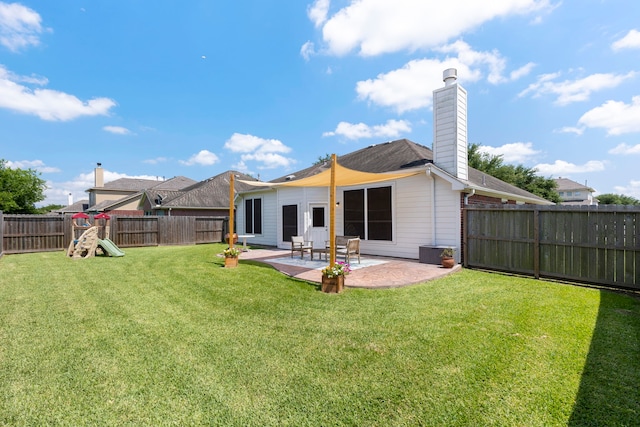 4613 Meridian Park Dr, Pearland, TX 77584 - rear view of property featuring a patio area and a chimney