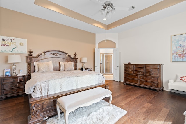 24914 Hazel Ranch Dr, Katy, TX 77494 - bedroom featuring a tray ceiling, wood finished floors, ceiling fan, and baseboards