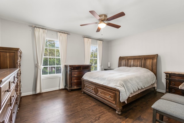 548 Cascade St, Bellaire, TX 77401 - bedroom with dark wood-type flooring, ceiling fan, and baseboards