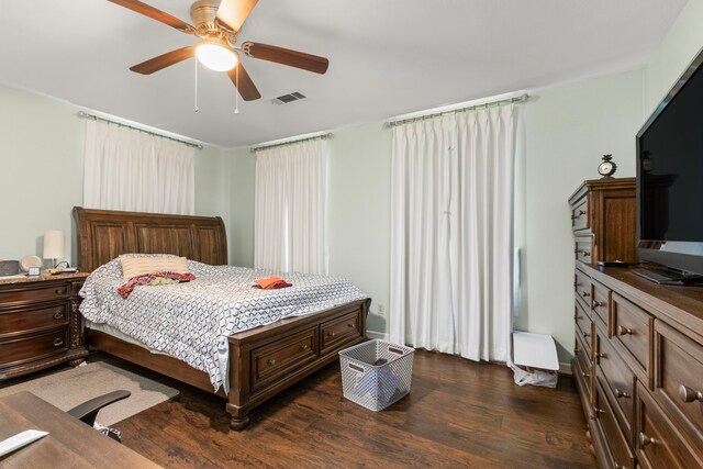 548 Cascade St, Bellaire, TX 77401 - bedroom with dark wood finished floors and a ceiling fan