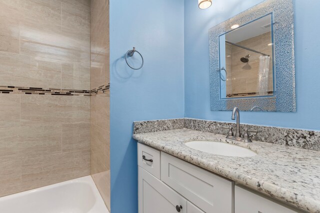 548 Cascade St, Bellaire, TX 77401 - bathroom featuring vanity and shower / bathtub combination with curtain
