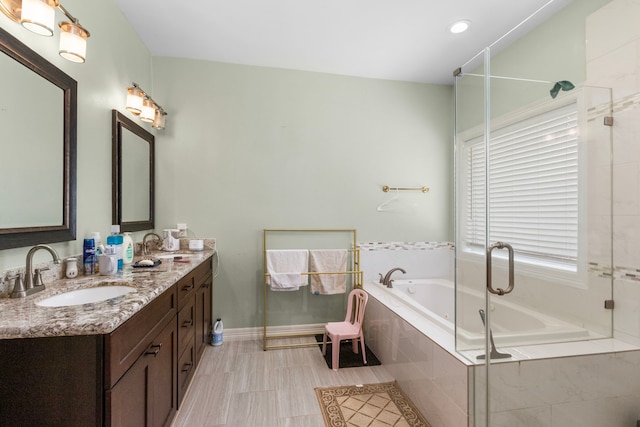 548 Cascade St, Bellaire, TX 77401 - bathroom featuring double vanity, a bath, and a shower with shower door
