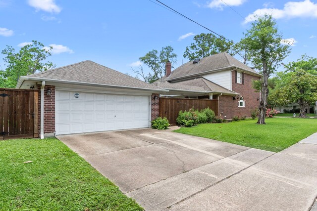 548 Cascade St, Bellaire, TX 77401 - view of home's exterior with brick siding, a garage, and a shingled roof