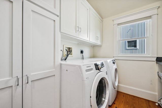 940 Columbia St, Houston, TX 77008 - washroom with washing machine and dryer, cabinet space, wood finished floors, and baseboards