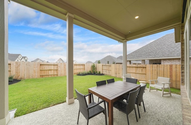 19318 Stagecoach Breeze Ln, Tomball, TX 77377 - view of patio / terrace featuring outdoor dining area and a residential view