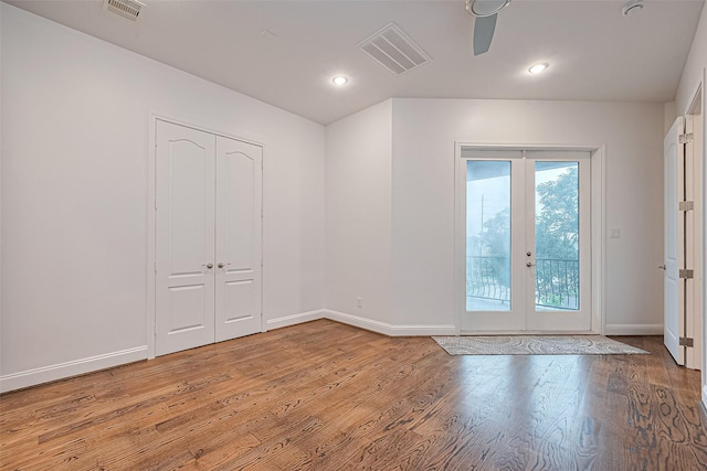 1035 Herkimer St, Houston, TX 77008 - empty room featuring french doors, baseboards, light wood-type flooring, and recessed lighting