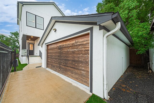 1035 Herkimer St, Houston, TX 77008 - view of property exterior with stucco siding and an attached garage