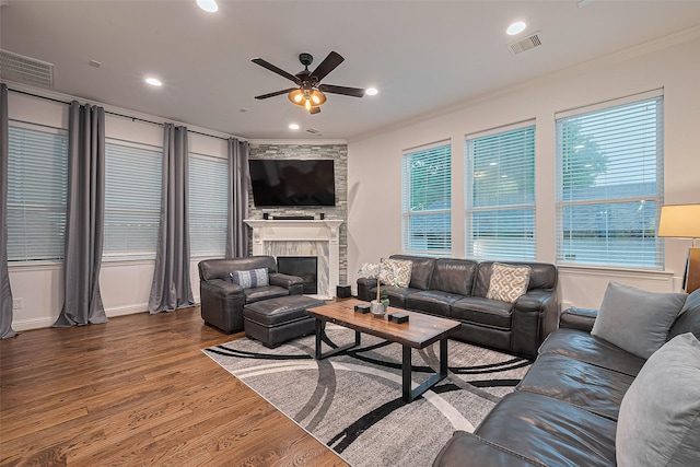 1035 Herkimer St, Houston, TX 77008 - living area with a ceiling fan, wood finished floors, a fireplace, ornamental molding, and recessed lighting