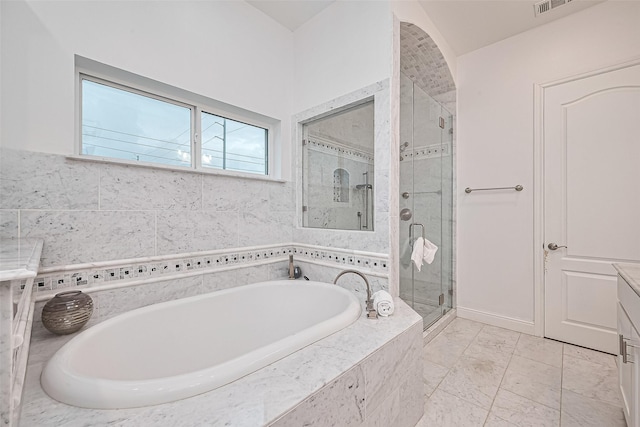 1035 Herkimer St, Houston, TX 77008 - full bathroom with a garden tub, a stall shower, and vanity