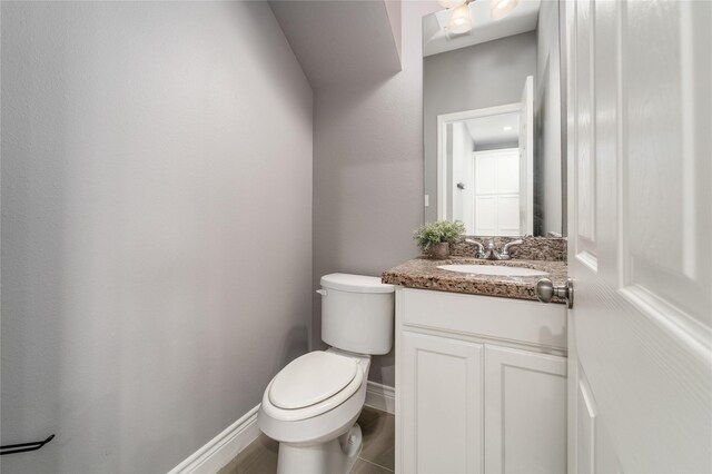 14619 Sanour Dr, Houston, TX 77084 - half bath featuring vanity, toilet, and baseboards