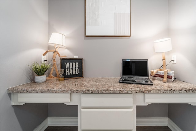 14619 Sanour Dr, Houston, TX 77084 - office area with built in desk, baseboards, and wood finished floors