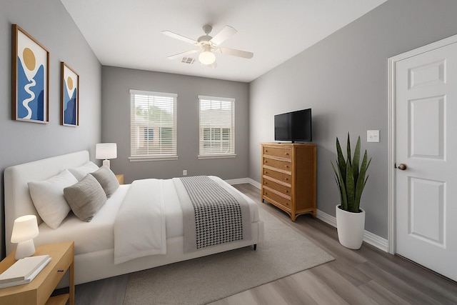 14619 Sanour Dr, Houston, TX 77084 - bedroom featuring wood finished floors, baseboards, and a ceiling fan