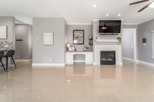 14619 Sanour Dr, Houston, TX 77084 - living area with a ceiling fan, crown molding, baseboards, a glass covered fireplace, and recessed lighting