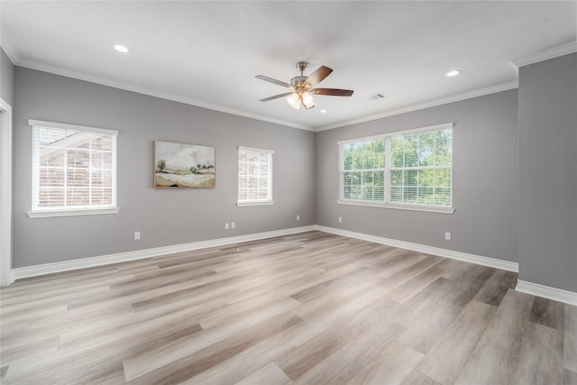 14619 Sanour Dr, Houston, TX 77084 - spare room featuring a ceiling fan, crown molding, light wood-style floors, baseboards, and recessed lighting