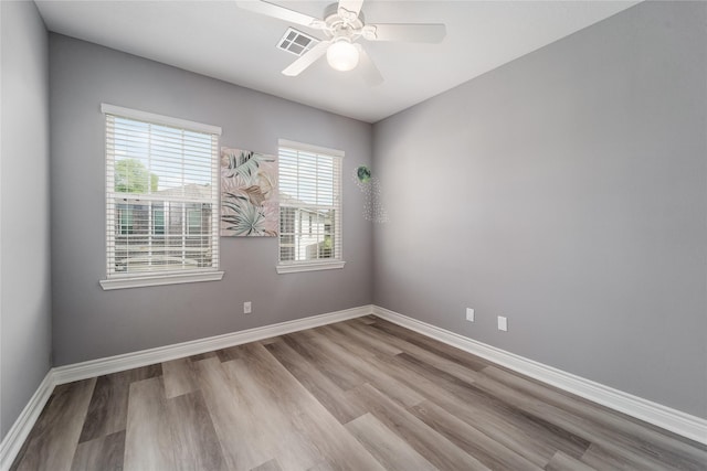 14619 Sanour Dr, Houston, TX 77084 - unfurnished room with wood finished floors, baseboards, and ceiling fan