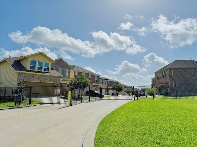 14619 Sanour Dr, Houston, TX 77084 - view of road featuring a residential view and a gate