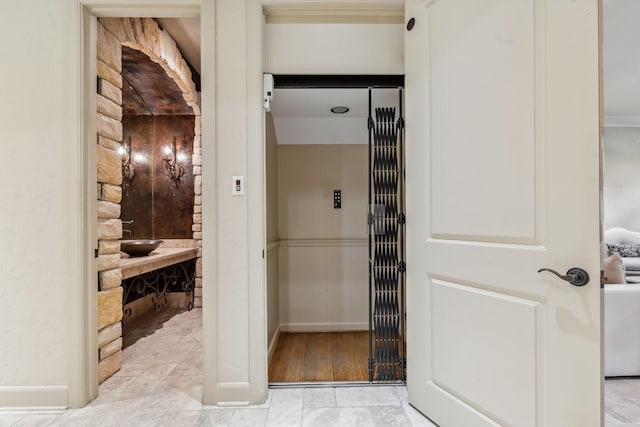 4922 Linden St, Bellaire, TX 77401 - bathroom featuring baseboards and elevator