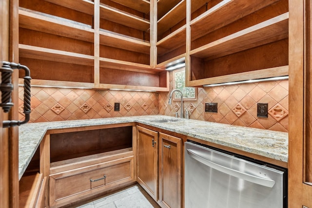 4922 Linden St, Bellaire, TX 77401 - kitchen with stainless steel dishwasher, a sink, backsplash, open shelves, and light stone countertops