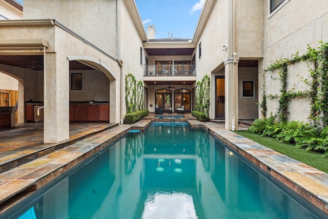 4922 Linden St, Bellaire, TX 77401 - view of swimming pool featuring a pool with connected hot tub