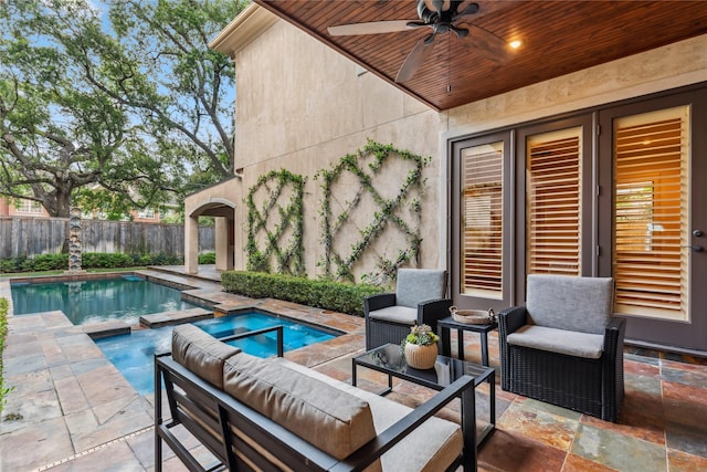 4922 Linden St, Bellaire, TX 77401 - view of swimming pool with a ceiling fan, a patio, an outdoor living space, and a pool with connected hot tub