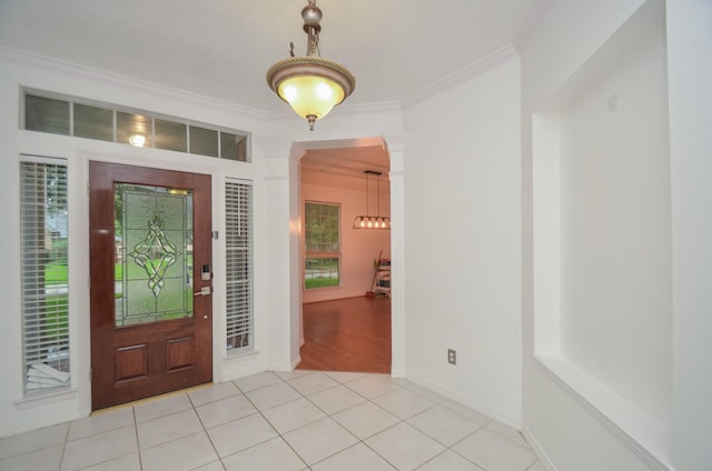 5319 Green Cove Bend Ln, Houston, TX 77041 - tiled entrance foyer featuring decorative columns, ornamental molding, and healthy amount of natural light