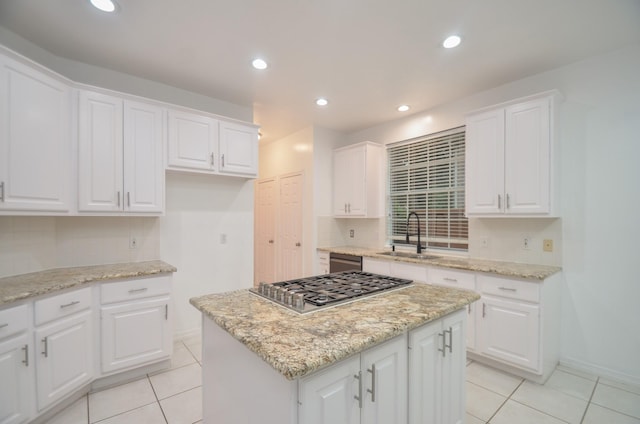 5319 Green Cove Bend Ln, Houston, TX 77041 - kitchen with stainless steel gas cooktop, dishwashing machine, light tile patterned flooring, a center island, and recessed lighting