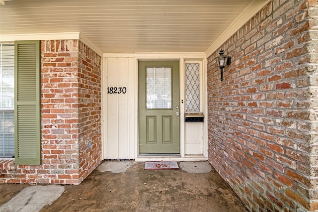 18230 Caprice Ln, Houston, TX 77058 - property entrance featuring brick siding and a porch