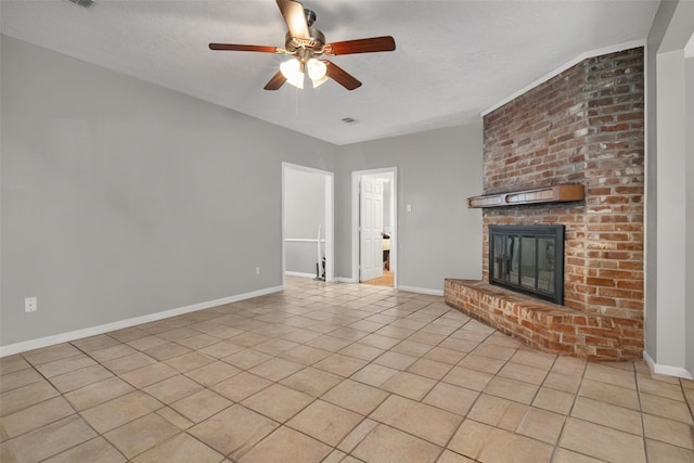 18230 Caprice Ln, Houston, TX 77058 - unfurnished living room featuring a ceiling fan, baseboards, a brick fireplace, and light tile patterned floors