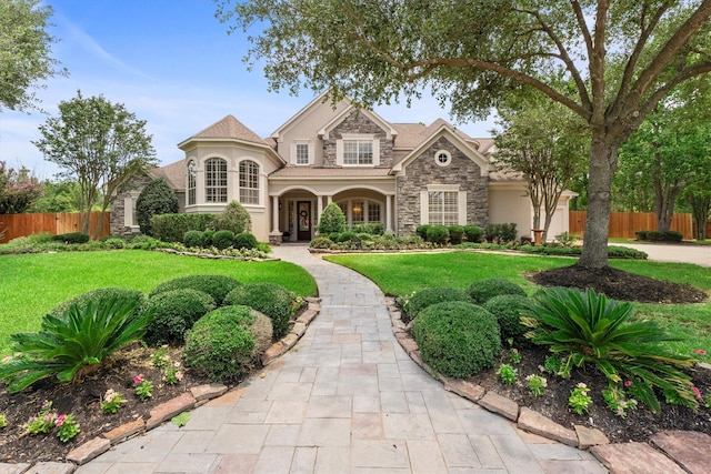 15222 Hilltop View Dr, Cypress, TX 77429 - view of front of home featuring stone siding and stucco siding