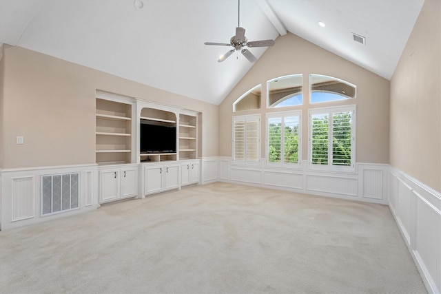 15222 Hilltop View Dr, Cypress, TX 77429 - unfurnished living room with a wainscoted wall, ceiling fan, high vaulted ceiling, beam ceiling, and light carpet