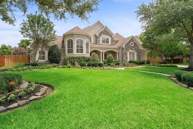 15222 Hilltop View Dr, Cypress, TX 77429 - view of front facade with stone siding and stucco siding