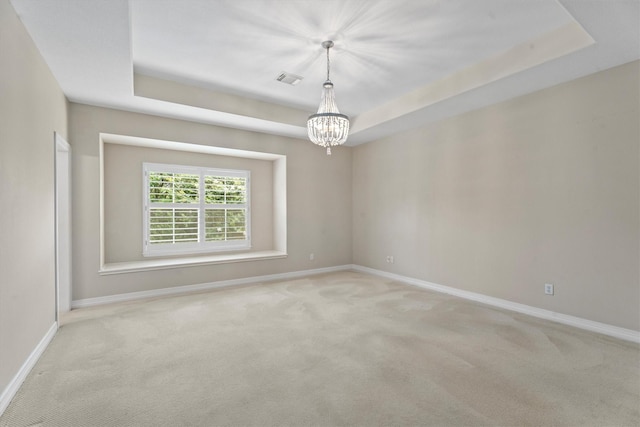 15222 Hilltop View Dr, Cypress, TX 77429 - spare room featuring a chandelier, carpet, and a raised ceiling