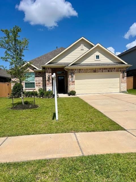 10809 Mendel Terrace Dr, Rosharon, TX 77583 - single story home with a garage, driveway, and brick siding