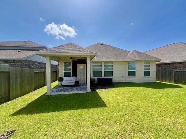 10809 Mendel Terrace Dr, Rosharon, TX 77583 - back of property with a ceiling fan and a patio