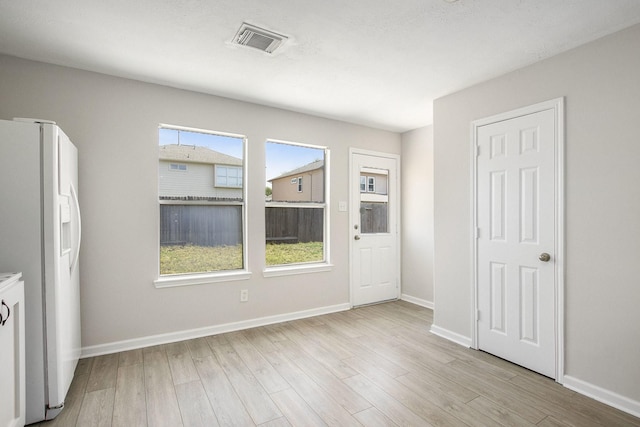 19238 Augusta Mist Ln, Katy, TX 77449 - unfurnished dining area featuring light wood finished floors and baseboards