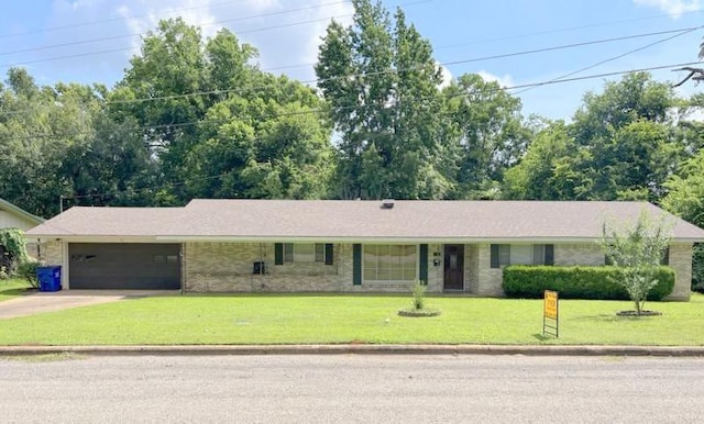 302 Cordell Dr, Crockett, TX 75835 - single story home with an attached garage, concrete driveway, a front yard, and brick siding