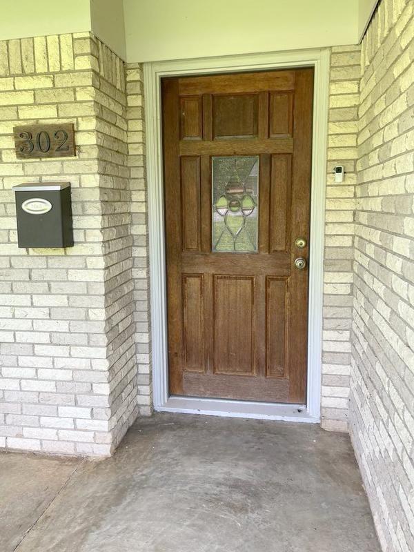 302 Cordell Dr, Crockett, TX 75835 - property entrance with brick siding