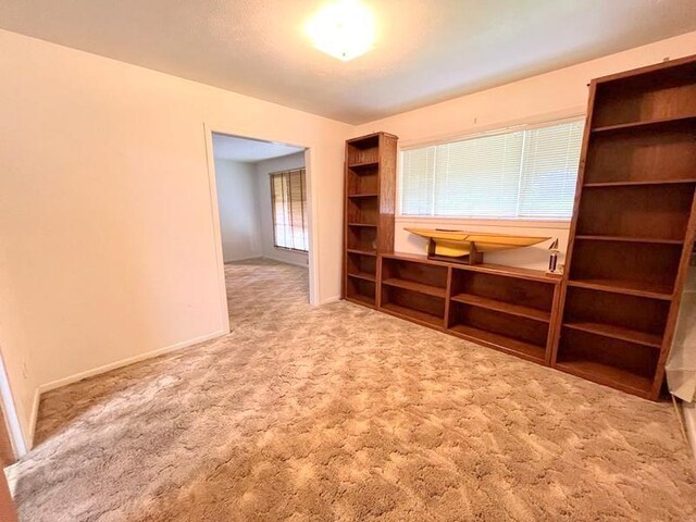302 Cordell Dr, Crockett, TX 75835 - empty room featuring carpet floors and baseboards