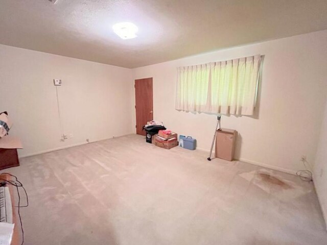 302 Cordell Dr, Crockett, TX 75835 - carpeted spare room featuring baseboards