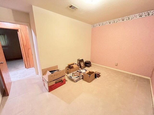 302 Cordell Dr, Crockett, TX 75835 - empty room featuring light colored carpet and baseboards