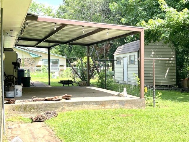 302 Cordell Dr, Crockett, TX 75835 - view of vehicle parking with a carport and a storage unit