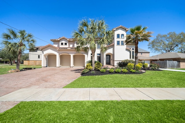4628 Beech St, Bellaire, TX 77401 - mediterranean / spanish home featuring stucco siding, driveway, a tile roof, and an attached garage
