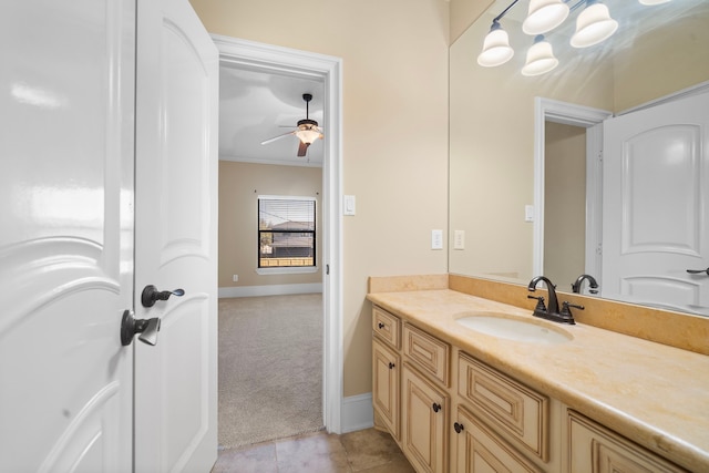 4628 Beech St, Bellaire, TX 77401 - bathroom featuring vanity, ceiling fan, ornamental molding, tile patterned floors, and baseboards