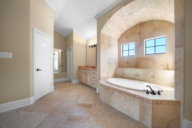 4628 Beech St, Bellaire, TX 77401 - bathroom featuring vanity, a garden tub, crown molding, and baseboards
