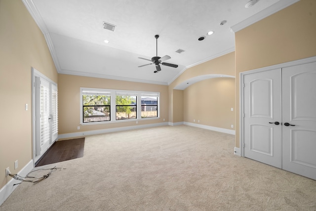 4628 Beech St, Bellaire, TX 77401 - unfurnished living room featuring ornamental molding, vaulted ceiling, light carpet, a ceiling fan, and baseboards