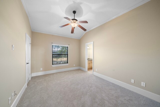 4628 Beech St, Bellaire, TX 77401 - spare room with ornamental molding, light carpet, ceiling fan, lofted ceiling, and baseboards