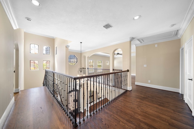 4628 Beech St, Bellaire, TX 77401 - corridor featuring crown molding, wood finished floors, attic access, recessed lighting, and baseboards