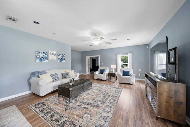 3525 N Morning Glory Dr, Santa Fe, TX 77517 - living room featuring ceiling fan, wood finished floors, and baseboards