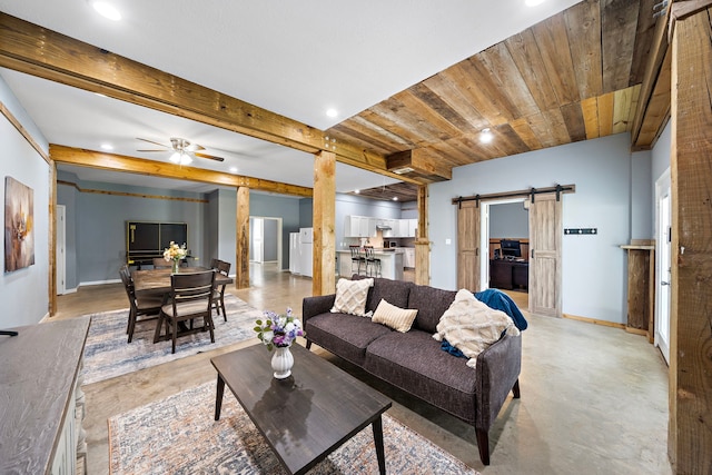 3525 N Morning Glory Dr, Santa Fe, TX 77517 - living room with a barn door, recessed lighting, concrete floors, baseboards, and ceiling fan